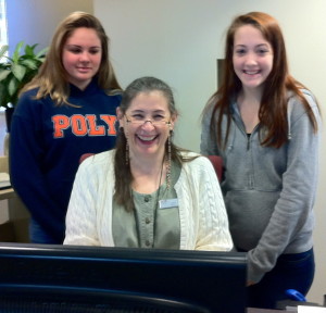 Librarian Ms. Julie with students Kelsey and Samantha.